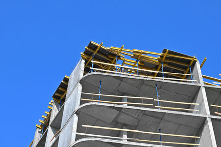 High-rise building construction site work with scaffolding