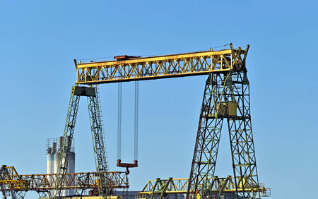 Full gantry crane over blue sky background