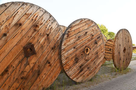 Wooden coil of electric cable on construction siteの写真素材