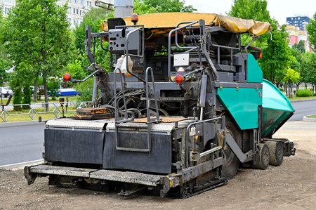 Asphalt paver machine on road construction site