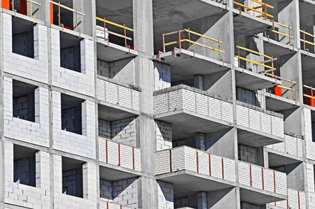 Building construction site work from concrete monolith and brick