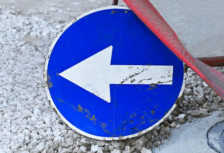 Arrow warning sign on road construction site work