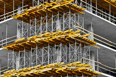 Multistage new building construction site with scaffoldingの写真素材