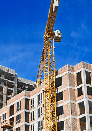 Multistage high-rise construction site and blue skyの写真素材