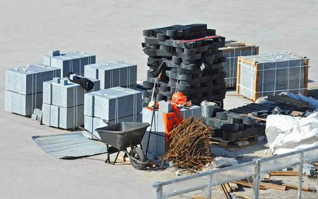 Granite border stone and equipment on construction site