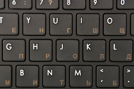 Close up of PC keyboard with latinic and cyrillic symbolの写真素材