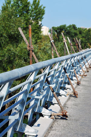 Scaffolding and railing on bridge construction siteの写真素材