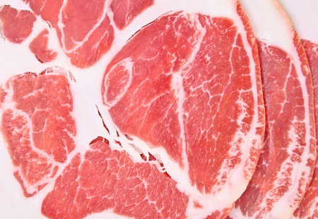 Background from sliced smoked ham, close up