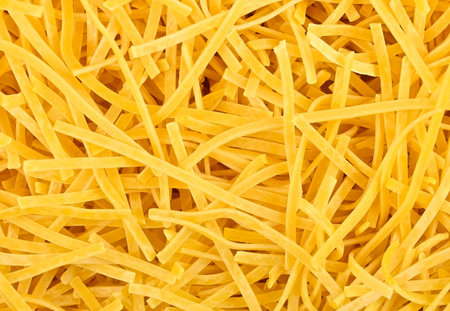 Tagliolini, textured egg pasta as food background