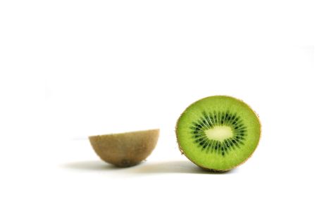 A green kiwi slice isolated on white backgroundの写真素材