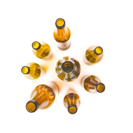 Brown beer bottles seen from above isolated on white backgroundの写真素材