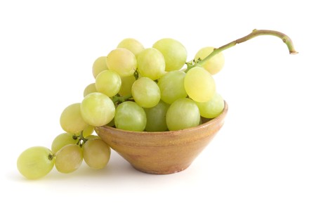 Bunch of Green grapes in a ceramic bowl; isolated on white backgroundの写真素材