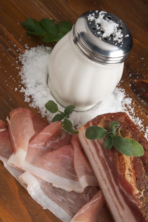 Italian Speck ham with salt and sageの写真素材