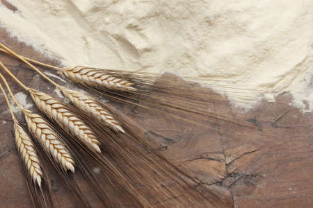 Flour and wheat on  a wooden tableの写真素材