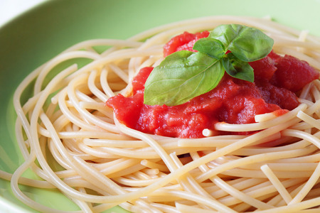 Close up on spaghetti pasta with tomato sauceの写真素材