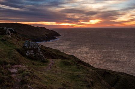 Beautiful sunset over the sea, high point of view. Photo taken in Cornwall, England.の写真素材