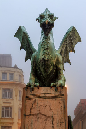 Famous dragon's sculpture on the Dragon's Bridge (Ljubljana - Slovenia). The dragon is the symbol of the Slovenian capital.の写真素材