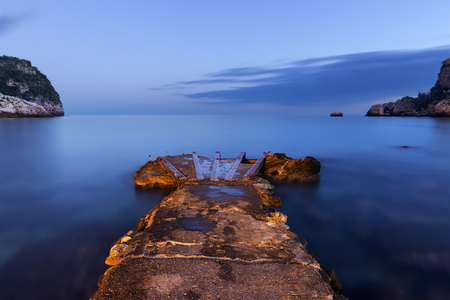 Old Pier on Mediterranean Sea at dusk.の写真素材