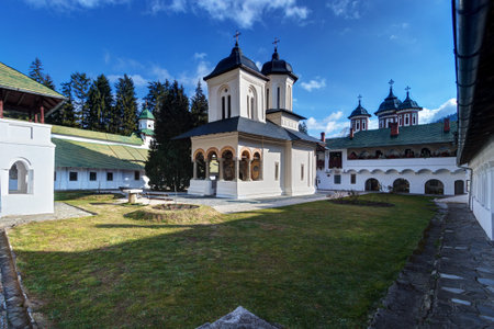 Sinaia, Romania: the Old Church (Biserica Veche) in Sinaia Monastery against a blue sky