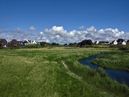 typical french landscape with river and green fieldの写真素材