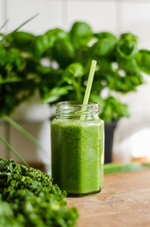 Closeup of bitter melon juice in jar on tableの写真素材
