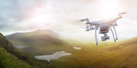 Multicopter drone flying over a scenic landscape in Ireland, Brandon Bay, Dingle peninsula, Co....