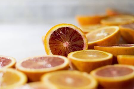 Red Blood Orange Slice and Orange Fruitの写真素材