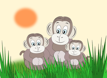 Three monkeys sitting together in the grass.の写真素材