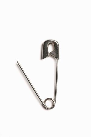 Open safety pin isolated on white backgroundの写真素材