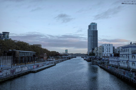 Wide angle cityscape view on the Brussels Havenlaan canal with skyscraper and apartmentsのeditorial素材