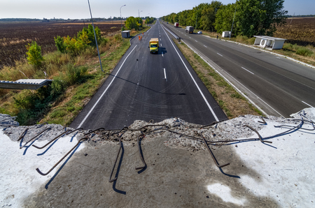 Road repair. Marking on a new road. View from a broken bridge.のeditorial素材
