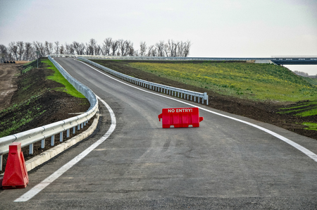 The road with railings and signの写真素材