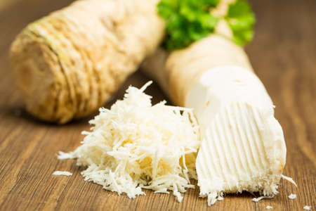Horseradish on wooden boardの写真素材