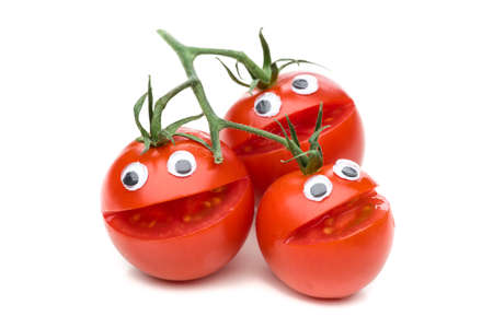 Three laughing tomatoes isolated on white backgroundの写真素材
