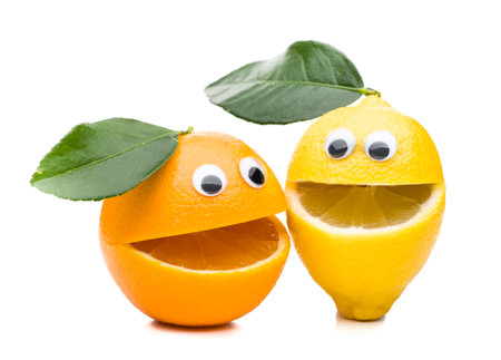 Laughing orange and lemon with leaf isolated on white backgroundの写真素材