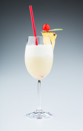 Cocktails: Pina Colada. Real edible cocktails on grey background - no artificial ingredients used.の写真素材