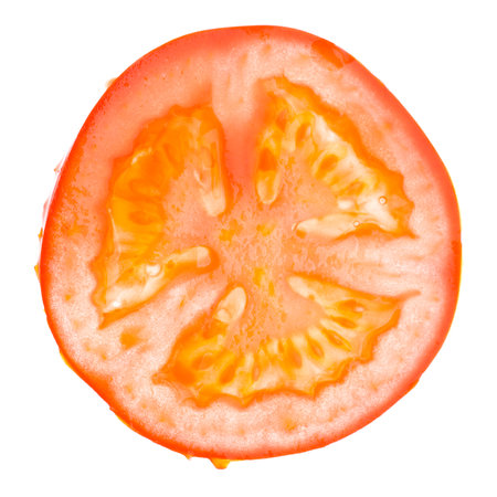 Single slice of a tomato isolated on white background. Real edible fruit and vegetable. Cutted to half or slices isolated on white background,の写真素材