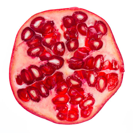Pomegranate slice isolated on white background. Real edible fruit and vegetable. Cutted to half or slices isolated on white background,の写真素材