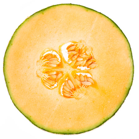 Slice of a muskmelon isolated on white background. Real edible fruit and vegetable. Cutted to half or slices isolated on white background,の写真素材