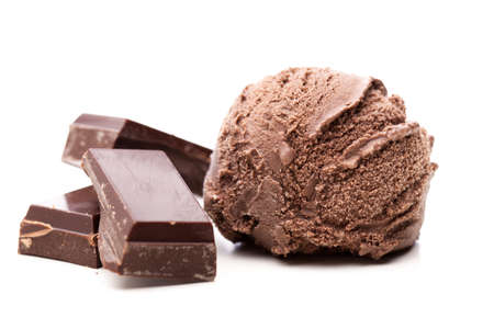 A scoop of chocolate ice cream with three pieces of chocolate isolated on white backgroundの写真素材