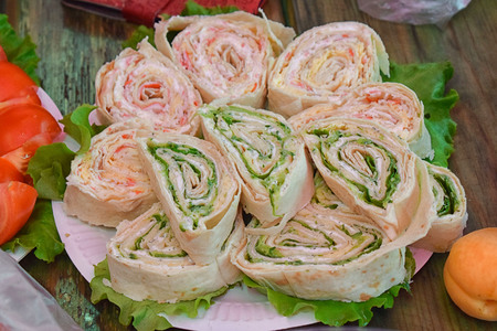 Rolls stuffed with herbs and sauce on the table for a holiday tastyの写真素材