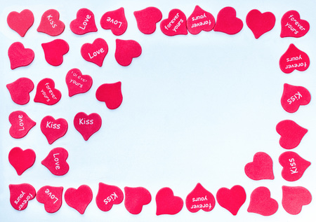 Frame for valentine card with scattered red hearts background white with place for text on right side loveの写真素材