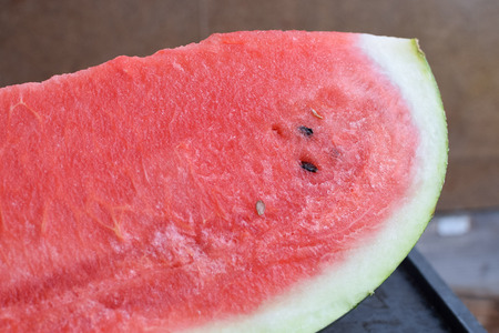 Slice of fresh red watermelon with seeds tastyの写真素材
