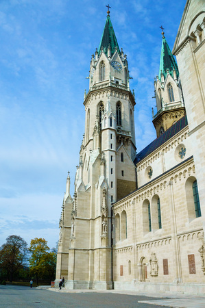 Old catholic church with high roofs with clear sky in Vienna Europeの写真素材