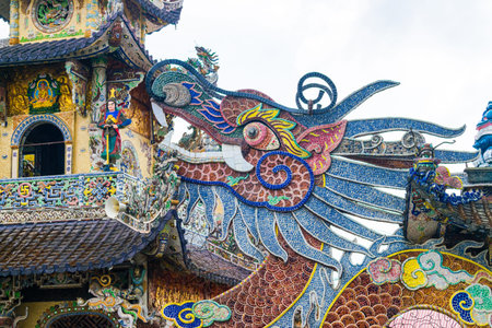 Colorful mosaic of porcelain in shape of dragon in pagoda in Dalat Vietnamの写真素材