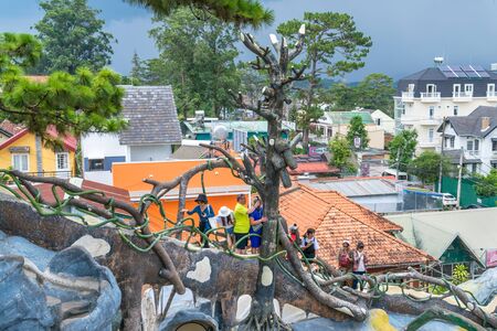 DALAT, VIETNAM - APRIL 15, 2019: Tourists walk through the constructions in amusement park Crazy House in Dalatのeditorial素材