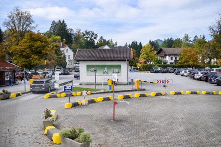 SCHWANGAU, GERMANY - OKTOBER 09, 2018: Parking for cars with yellow borders in tourist place in the...
