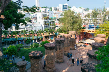 NHA TRANG, VIETNAM - APRIL 21, 2019: View of religious ancient monument po nagar with asian city on background in Vietnamのeditorial素材