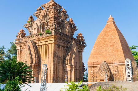 Tall Buddhist temple building with red bricks wall and monumentの写真素材