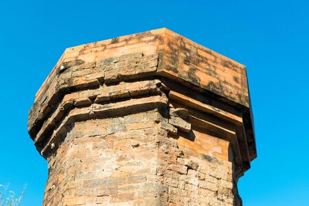Top of ancient red brick tower of cham culture in Vietnam under sunlightの写真素材